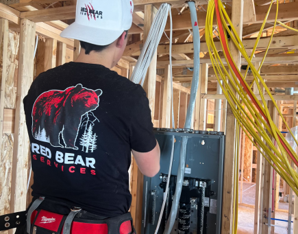 A man rewires a home professionally.