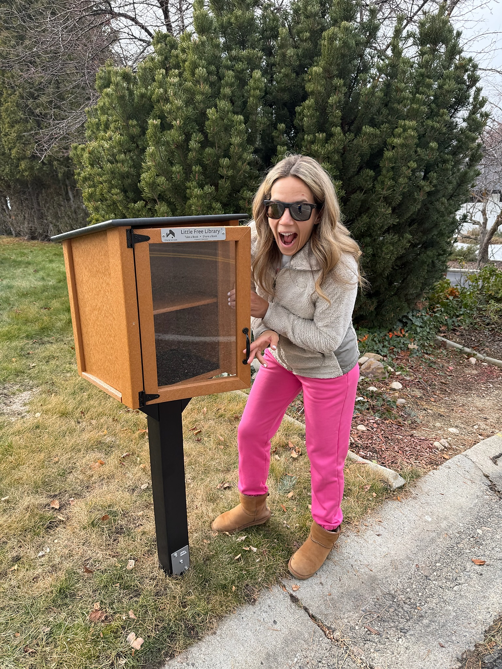 A super stoked D’Arcy after the hubs got the little lending library all set up, for all to enjoy!