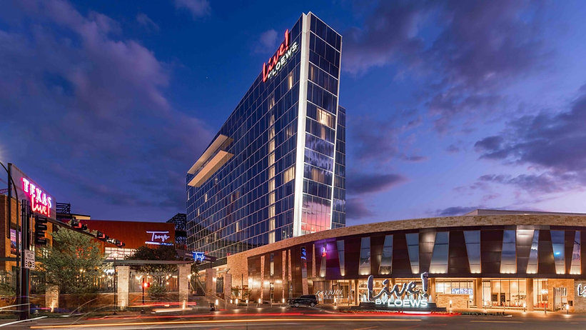 Live! by Loews hotel in Arlington, Texas. Exterior shot of the building from below at nigh