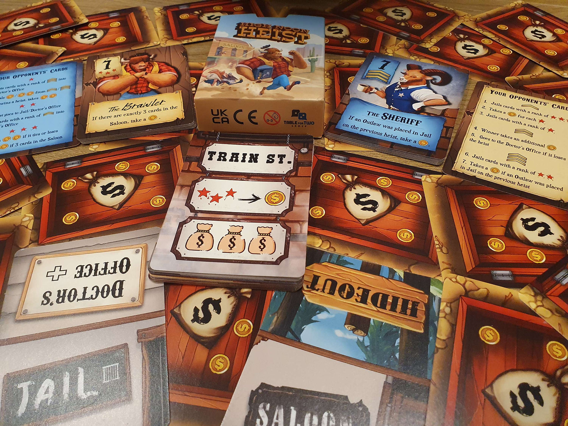 Location cards from the game High Noon Heist including the Doctors Office/Jail and Hideout/Saloon.