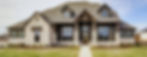 Newly built farmhouse featuring classic gable rooflines, board and batten siding, and a welcoming front porch, blending timeless charm with modern construction