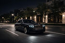 Rolls-Royce Ghost ultra-luxury sedan nighttime city scene – PrestigeJetSet