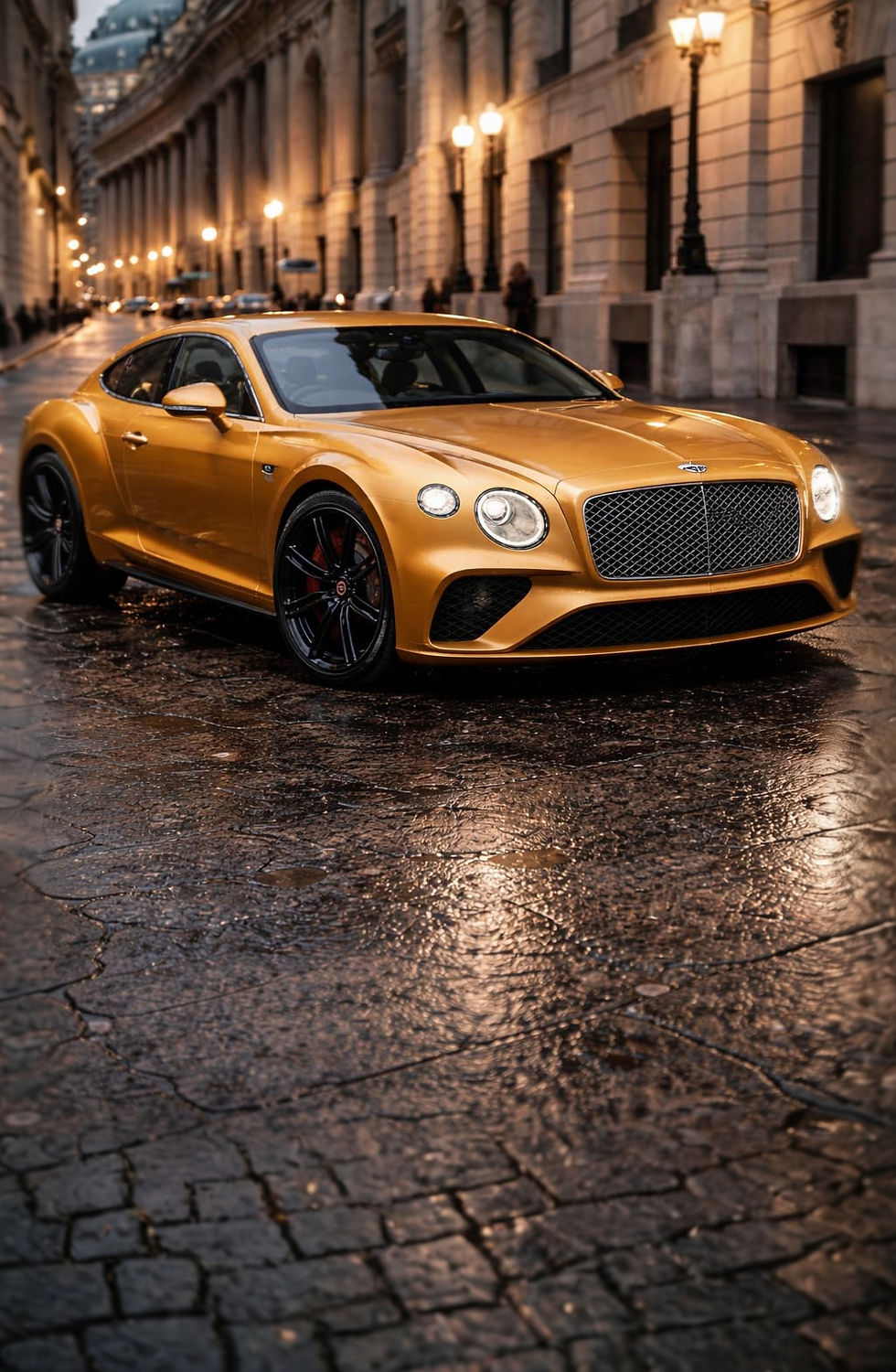 Gold Bentley Continental GT parked on a wet city street at night with luxury building lights reflecting on the pavement