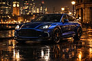 Blue Aston Martin luxury sports car parked in London at night near Big Ben - exotic car rental London by PrestigeJetSet