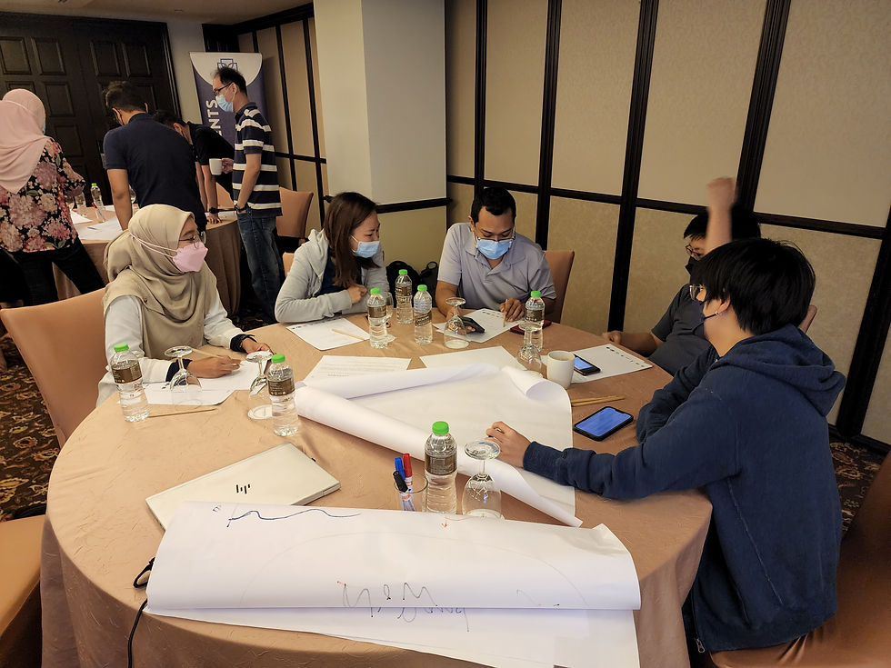 Group of people collaborating around a table, working together on a project or discussion during a w