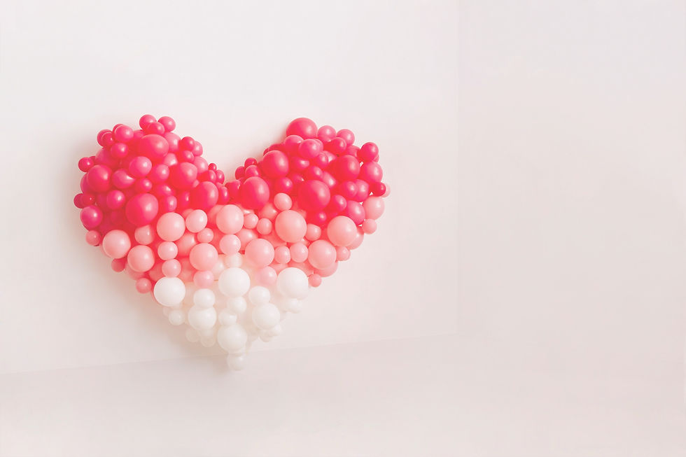 Heart of pink balloons on a white wall_edited.jpg