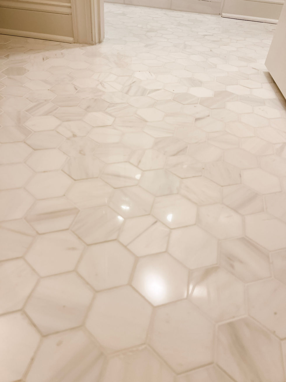 marble hex tile flooring in a bathroom home renovation near Davidson, NC