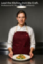 Woman chef in maroon apron, cooking food in kitchen