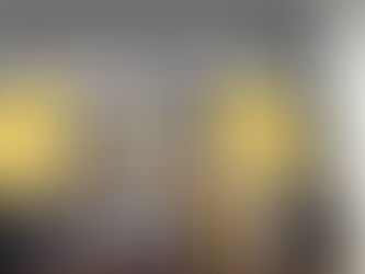 Group of boys posing in front of a large sign reading "The Mike Way". Some flexing, diverse expressions. Black and gold backdrop. Gym setting.