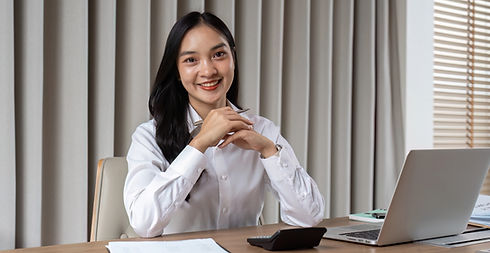 Smiling businesswoman at desk