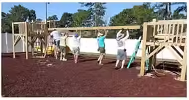 Volunteers constructing a playground