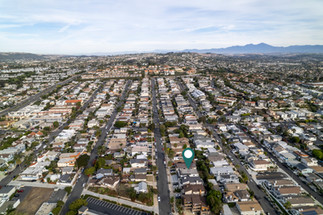 Street-facing balcony at 34092 Alcazar Dr featuring textured stucco walls, a modern light fixture, and a scenic outlook over the quiet residential neighborhood