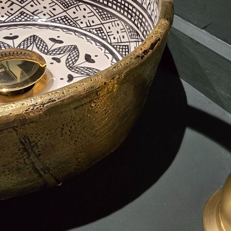 small bathroom design, a wc with wow factor, hand crafted Moroccan sink. Walls colour drenched in little greene, obsidian green.  