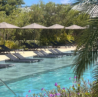 The pool and in-water pool chairs at Live Aqua Punta Cana
