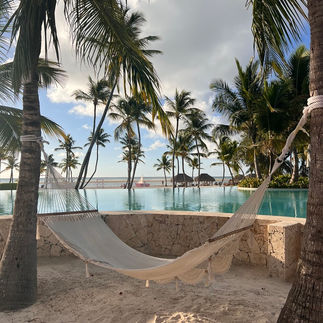 A relaxing hammock near the pool and beach at Secrets Cap Cana
