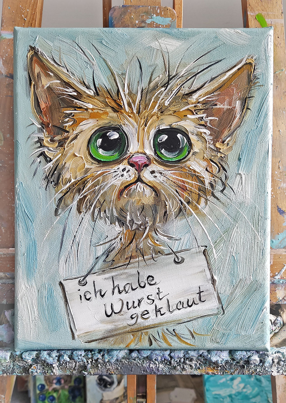 Miniaturbild: Niedliches Kätzchen mit Schild