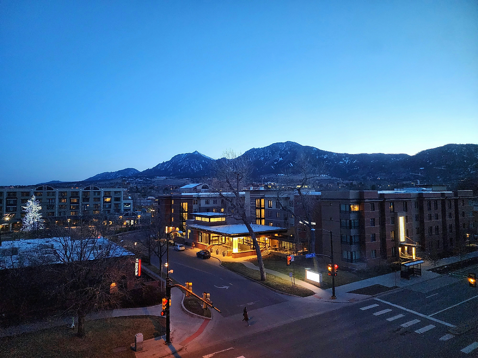 Evening street view of Boulder, Colorado with the Flatirons in the background, representing mental health treatment center services for Boulder residents by Chateau Health and Wellness.