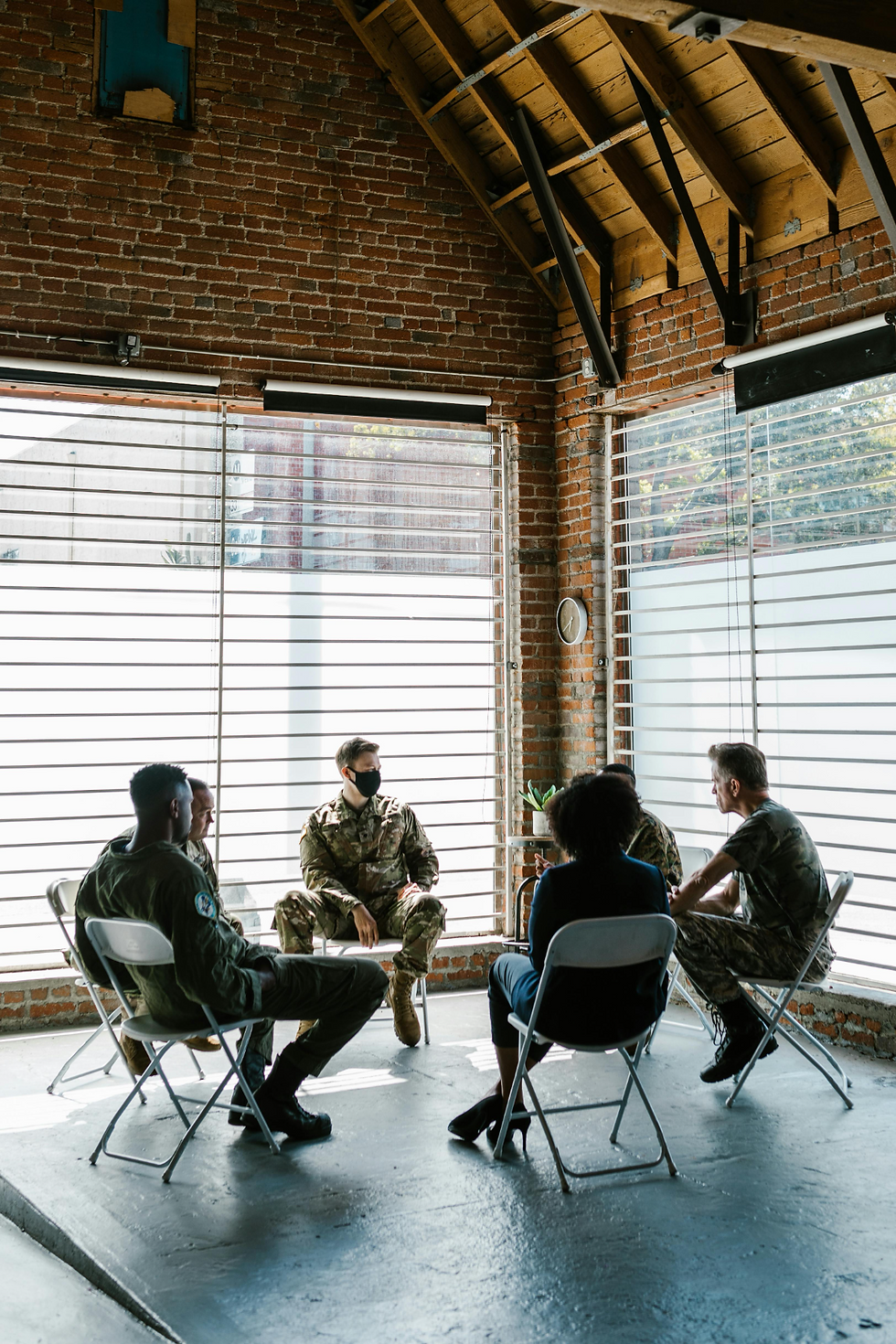 A group of individuals in a circle during an intensive therapy session.