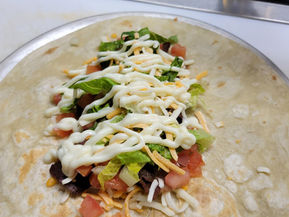 burrito being rolled