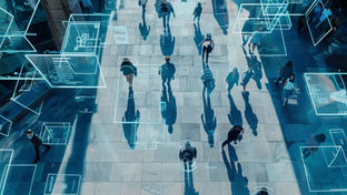 Crowd density measurement system analyzing pedestrian movement with digital overlays tracking people in a public space