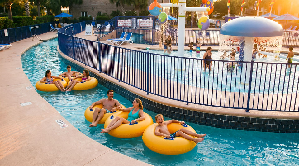 Vacationers enjoying the Lazy River and the Splash Pad at Grand Palms Resort during their Myrtle Beach Vacation.