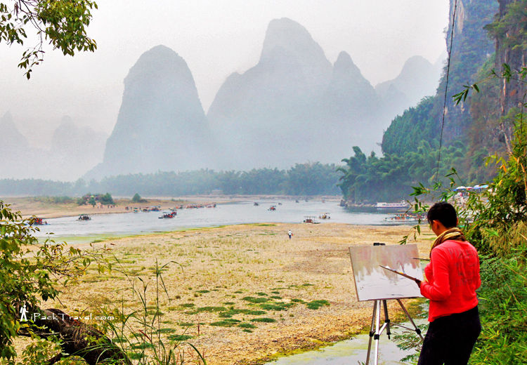 Lady painting Guilin scenery