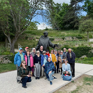 Bryn is with the lovely group of people who went on the tour, standing under a statute of Dom Pérignon