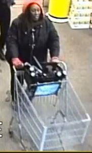 Woman walks out of store with vodka