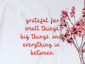 A soft image with pink flowers on the right side and a handwritten quote that reads “grateful for small things, big things, and everything in between.”