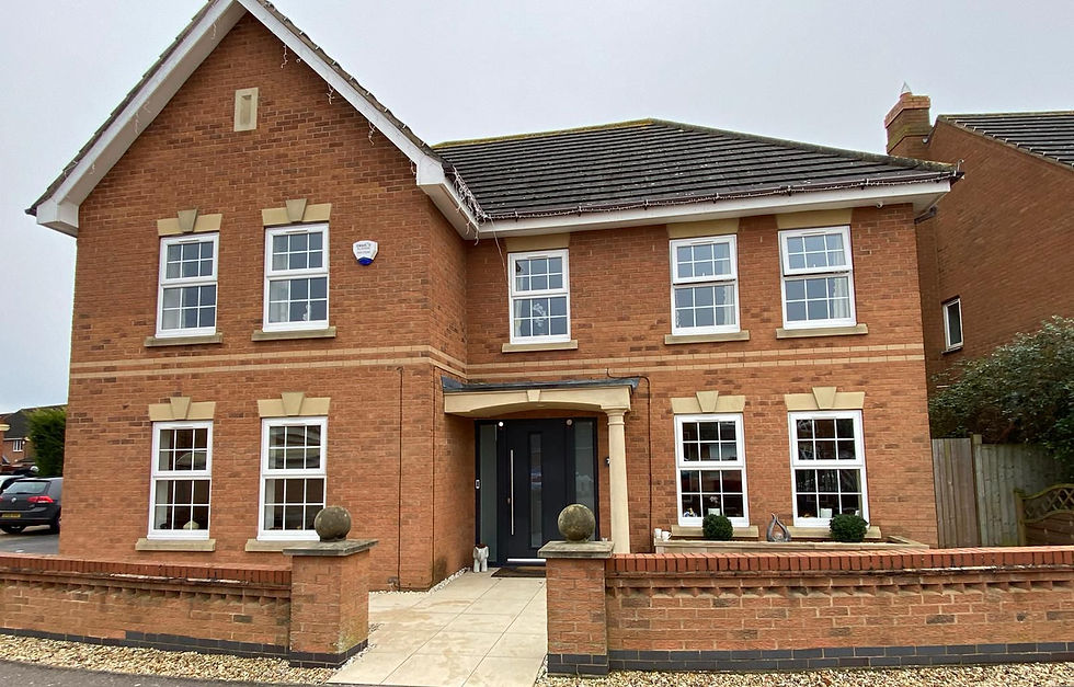 new windows and doors on orange brick house_edited.jpg