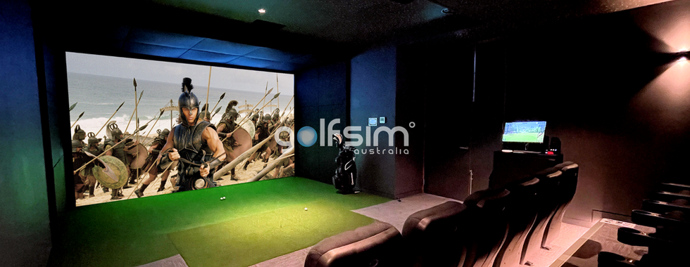 High-end golf simulator room with theatre-style seating and dual-purpose setup for immersive movie viewing and indoor golf play.