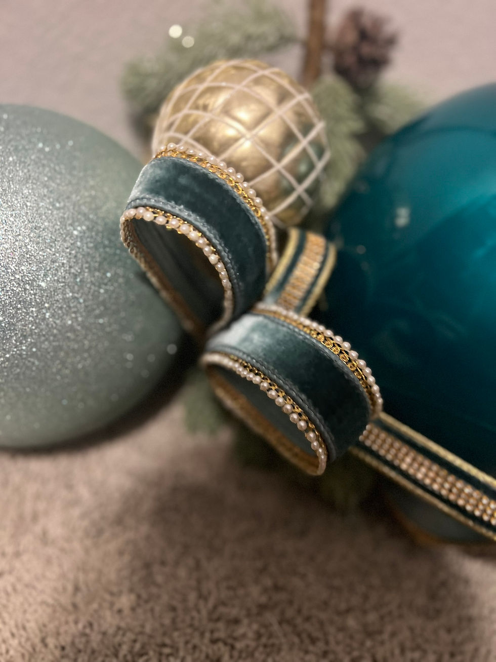 holiday color palette ornaments in teal and champagne by a Prosper TX holiday decorator
