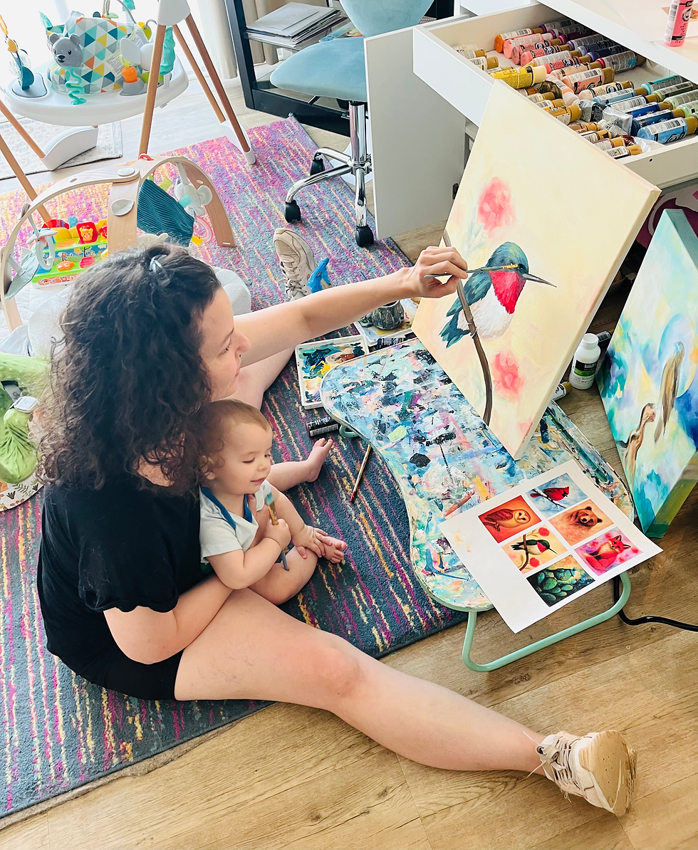 With the little velcro baby painting a hummingbird