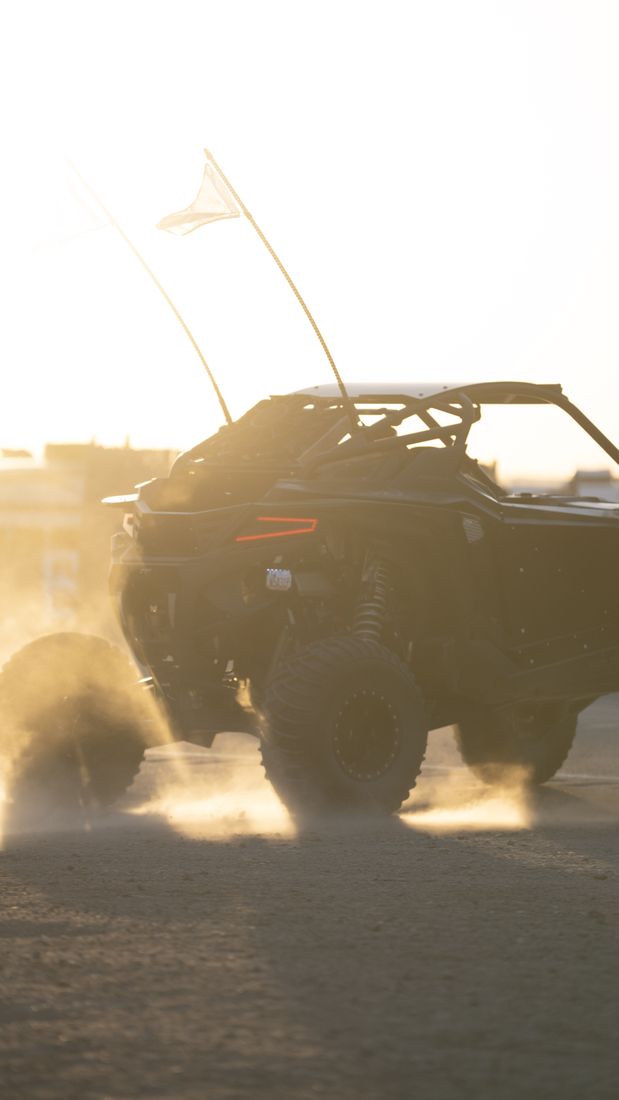 A dune buggy kicking up sand at Glamis