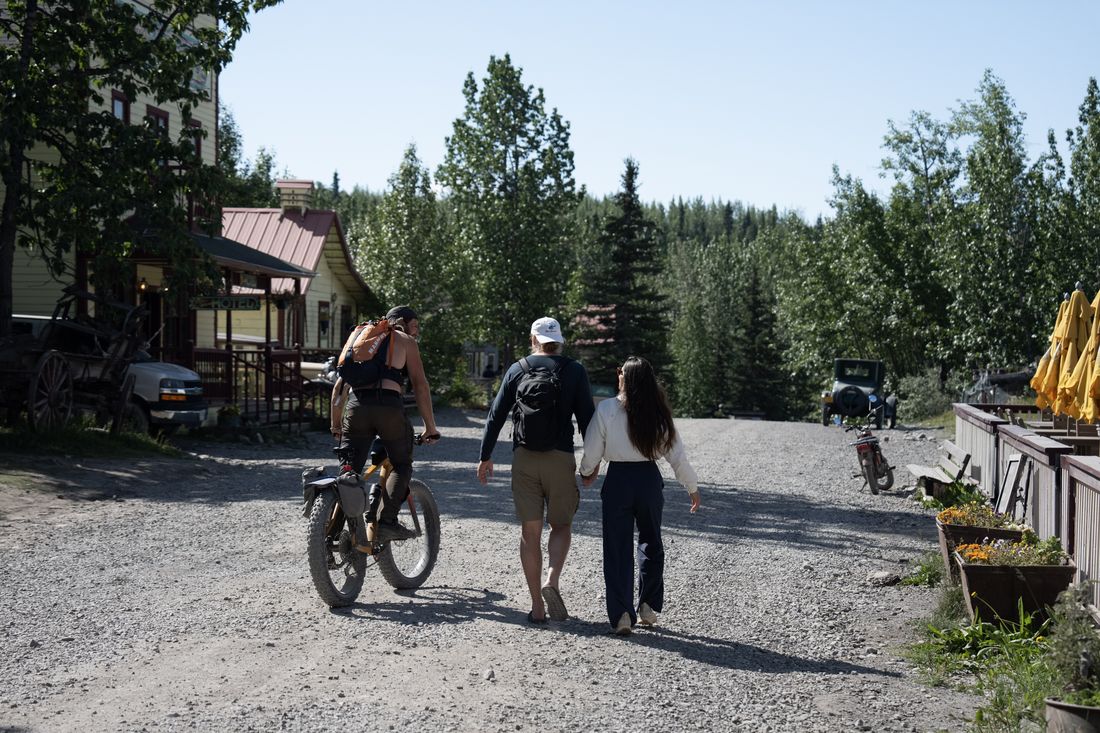 Friends setting off together on e-bikes in Alaska