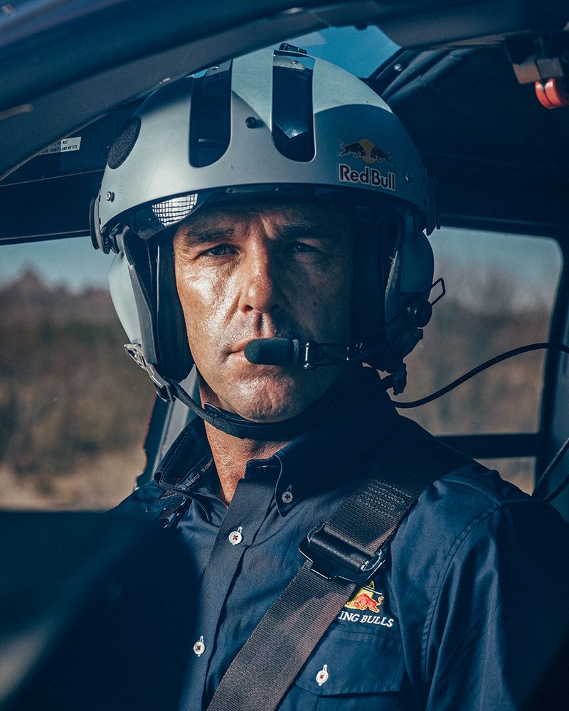 Aaron Fitzgerald in a flight helmet in the cockpit