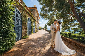 Wedding couple on curved sea-view terrace at Casa de Santa Clotilde, Lloret de Mar, Costa Brava