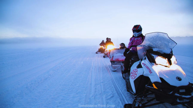 Experience the magic of Lapland with our Arctic Adventure Day in Rovaniemi, Finland (Lapland). Enjoy a snowmobile drive through snowy landscapes, meet and ride with reindeer, savor a delicious lunch at a local farm, and embark on a thrilling 5 km husky safari. Book your unforgettable Arctic adventure online at https://www.scandinavian-travel-group.com. Arctic Adventure Day in Rovaniemi, Lapland: Snowmobile, Reindeer, and Husky Safari with Scandinavian Travel Group!