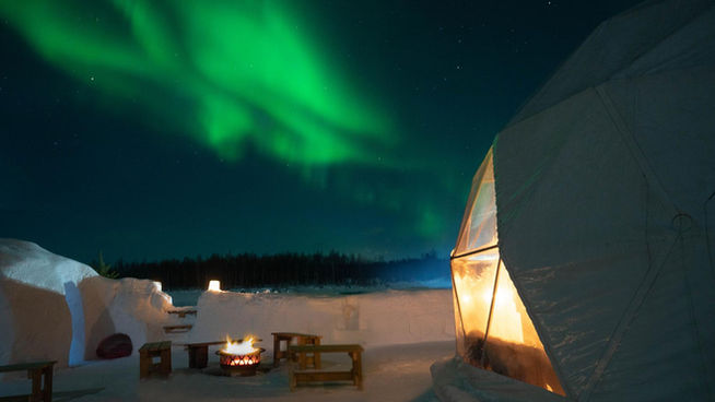 Northern Lights tour in Levi, Lapland, in Snow Igloo Park with Scandinavian Travel Group. Experience Polarman's Camp and Snow Igloo Park: An Enchanting Arctic Adventure

Welcome to Polarman's Camp and Snow Igloo Park, an exclusive haven just outside Levi, Finland (Lapland), where the magic of the Northern Lights and the charm of a Snow Igloo Park await you. Escape the tourist buzz and immerse yourself in a serene atmosphere with an unobstructed Northern horizon view, a panoramic 360⁰ sky view, minimal light pollution, and a cozy Aurora dome shelter!