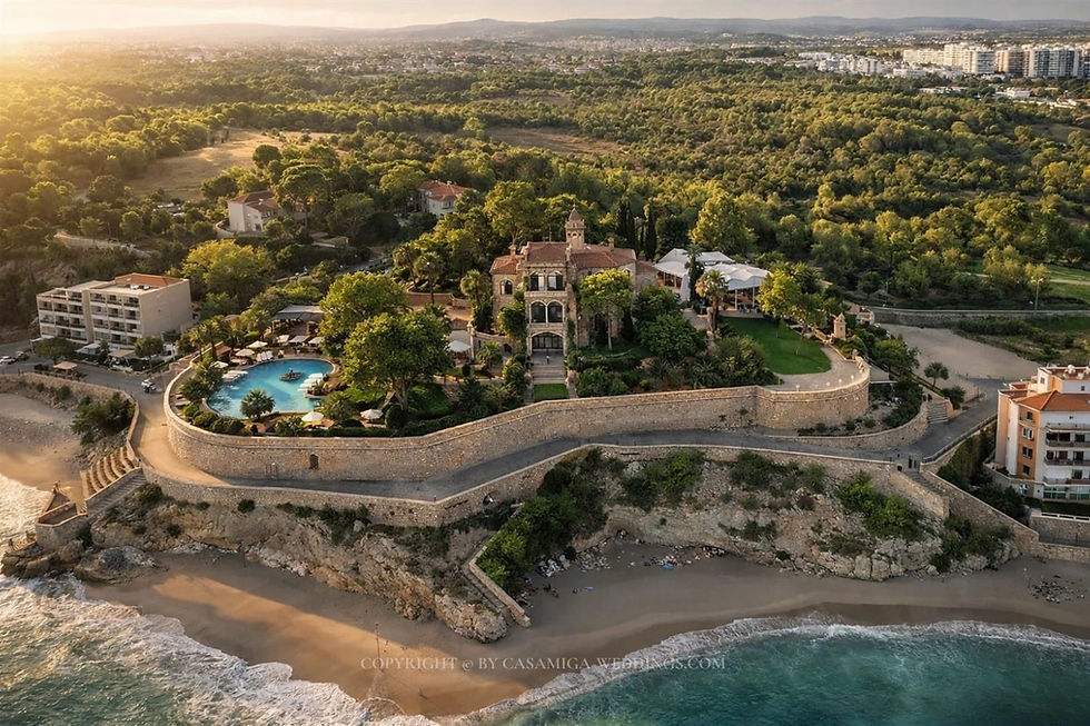 Coastal rustic wedding venue Xalet de Nin, in the Barcelona region, a seaside villa with a pool, surrounded by lush greenery and a stone wall. Beach and ocean waves in the foreground. | Casamiga Weddings Planner. Xalet de Nin. Aerial view of a seaside villa with a pool, surrounded by lush greenery and a stone wall. Beach and ocean waves in the foreground.