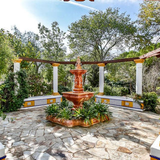 Lush Mediterranean garden setup at Masía Can Parès, a rustic wedding venue in Sitges, ideal for summer weddings in Catalonia. Casamiga Weddings Planner.