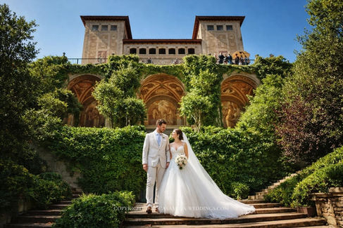 Wedding couple at ornate villa entrance at Bell Recó historic estate, Argentona, Maresme, near Barcelona