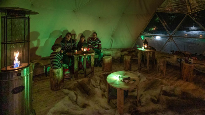 Northern Lights tour in Levi, Lapland, in Snow Igloo Park with Scandinavian Travel Group. Experience Polarman's Camp and Snow Igloo Park: An Enchanting Arctic Adventure

Welcome to Polarman's Camp and Snow Igloo Park, an exclusive haven just outside Levi, Finland (Lapland), where the magic of the Northern Lights and the charm of a Snow Igloo Park await you. Escape the tourist buzz and immerse yourself in a serene atmosphere with an unobstructed Northern horizon view, a panoramic 360⁰ sky view, minimal light pollution, and a cozy Aurora dome shelter!