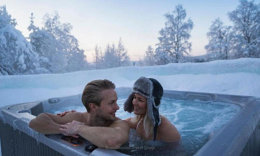 Immerse yourself in the magic of the Arctic Snow Hotel, Finland. Book a Northern Lights Sauna Experience with a private Finnish sauna, outdoor jacuzzi, and a delectable dinner by an open fire. Unforgettable moments await in Rovaniemi! 