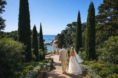 Wedding couple on cypress-lined garden path at Jardines Marimurtra, Blanes, Costa Brava Spain