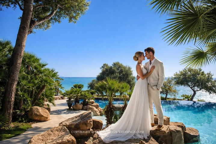 Wedding couple in tropical garden at Xalet de Nin seafront estate, Vilanova i la Geltrú, near Sitges Spain