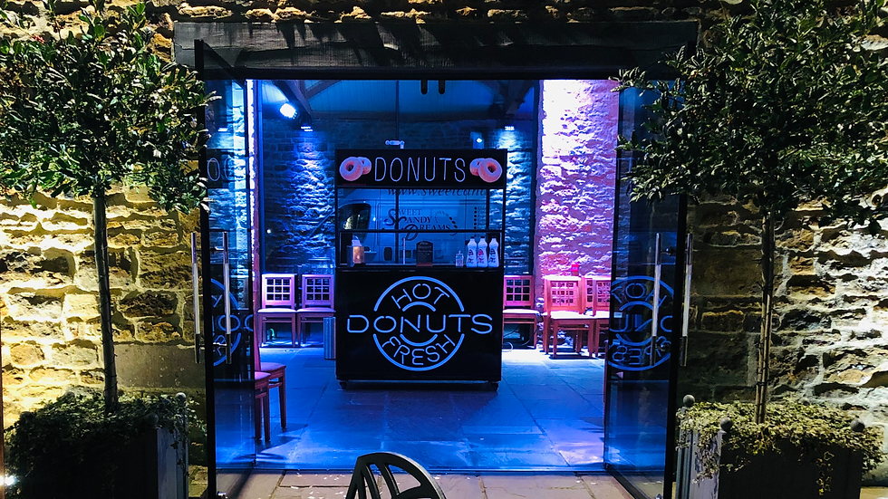 donuts cart at a wedding serving donuts