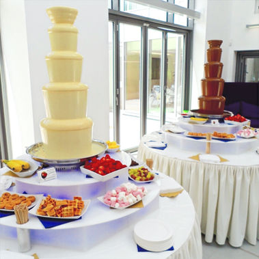 white chocolate fountain with a milk chocolate fountain
