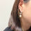 Thumbnail: Circle Pearl Earrings Silver Clip On