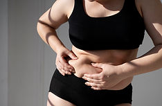 front-view-woman-holding-her-belly.jpg